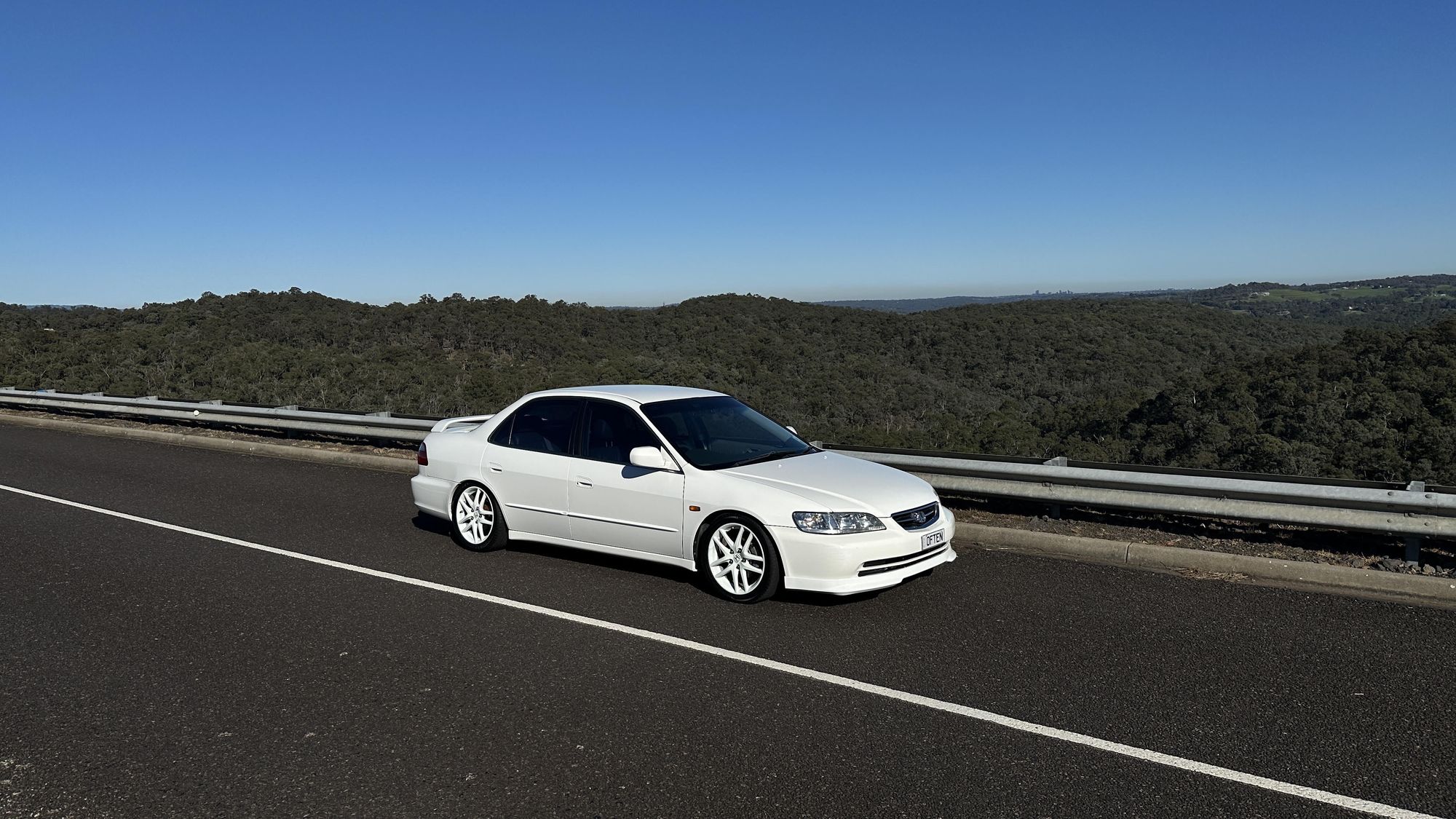 A freshly detailed car gleaming under studio lighting